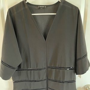 Stella & Dot size medium black summer top with eyelet cutouts.